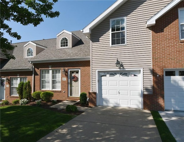 1065 Duncan Ln, Whitehall, PA 15236 - view of front facade featuring brick siding, roof with shingles, driveway, a garage, and a front lawn