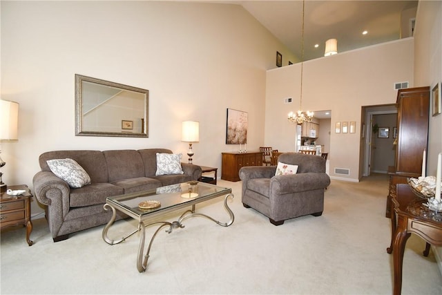 1065 Duncan Ln, Whitehall, PA 15236 - living area with light colored carpet, a chandelier, and high vaulted ceiling