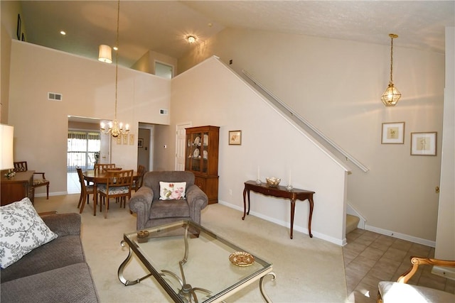 1065 Duncan Ln, Whitehall, PA 15236 - carpeted living room featuring stairs, high vaulted ceiling, and a chandelier