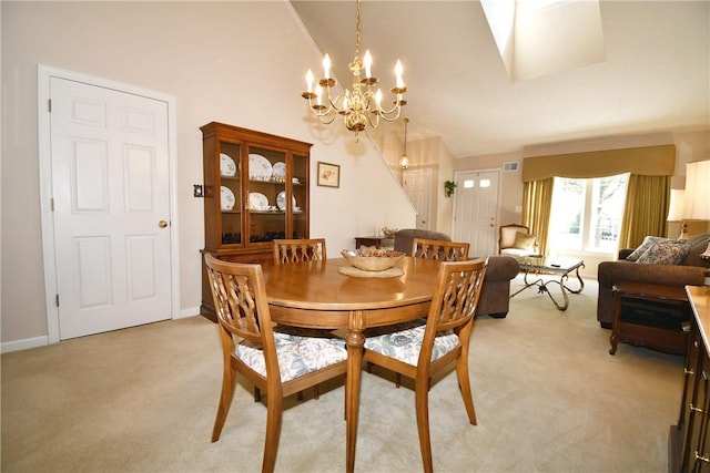 1065 Duncan Ln, Whitehall, PA 15236 - dining space with light colored carpet, a chandelier, and lofted ceiling