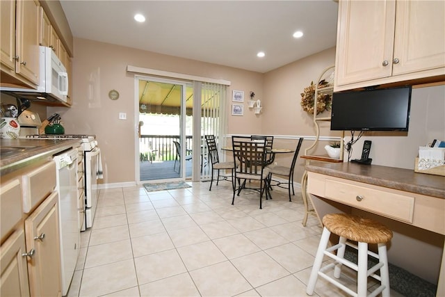 1065 Duncan Ln, Whitehall, PA 15236 - kitchen featuring white appliances, light tile patterned floors, dark countertops, and recessed lighting