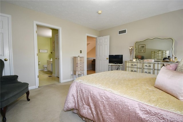 1065 Duncan Ln, Whitehall, PA 15236 - bedroom with light colored carpet and ensuite bathroom