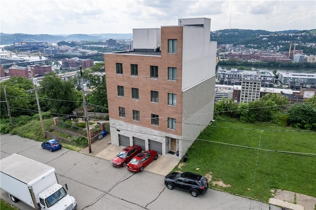 1825 Arcena St Unit 3, Downtown Pgh, PA 15219 - view of property with a view of city, an attached garage, and concrete driveway