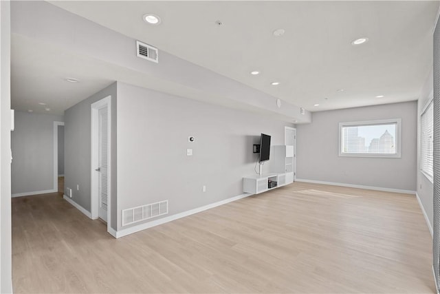 1825 Arcena St Unit 3, Downtown Pgh, PA 15219 - unfurnished living room with light wood finished floors and recessed lighting