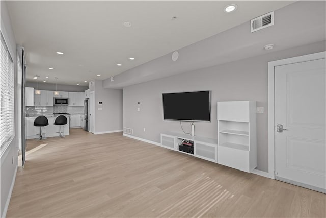 1825 Arcena St Unit 3, Downtown Pgh, PA 15219 - unfurnished living room with light wood finished floors and recessed lighting