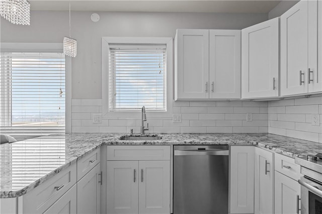 1825 Arcena St Unit 3, Downtown Pgh, PA 15219 - kitchen featuring dishwasher, white cabinets, backsplash, a chandelier, and pendant lighting