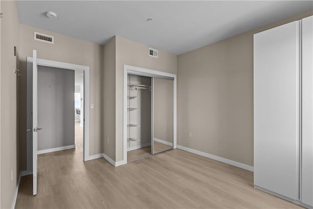 1825 Arcena St Unit 3, Downtown Pgh, PA 15219 - unfurnished bedroom with light wood finished floors and a closet