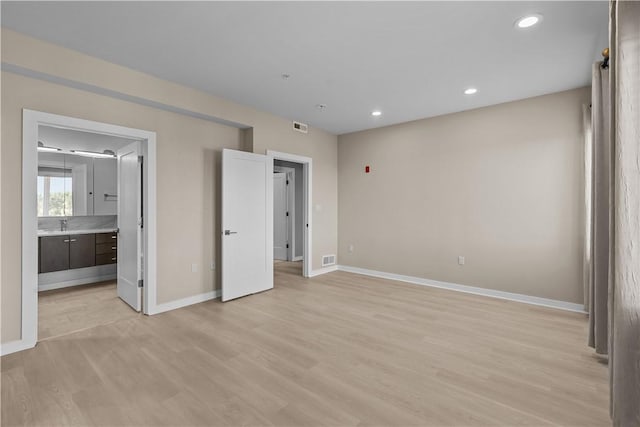 1825 Arcena St Unit 3, Downtown Pgh, PA 15219 - unfurnished bedroom featuring light wood-style flooring, recessed lighting, and connected bathroom