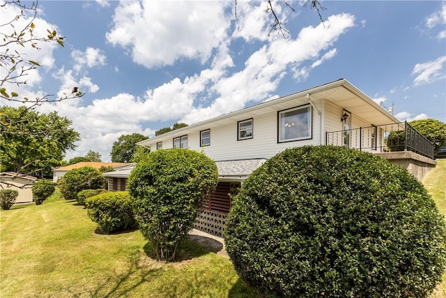 108 Dave St, Daugherty Twp, PA 15066 - rear view of house featuring a lawn and a balcony