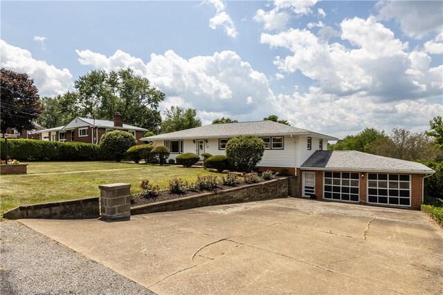 108 Dave St, Daugherty Twp, PA 15066 - view of front of home featuring concrete driveway, brick siding, an attached garage, and a front lawn