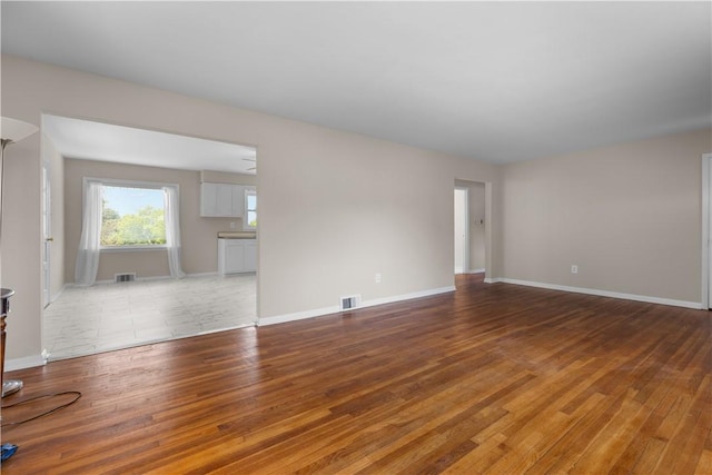 108 Dave St, Daugherty Twp, PA 15066 - unfurnished living room with light wood-style flooring and baseboards