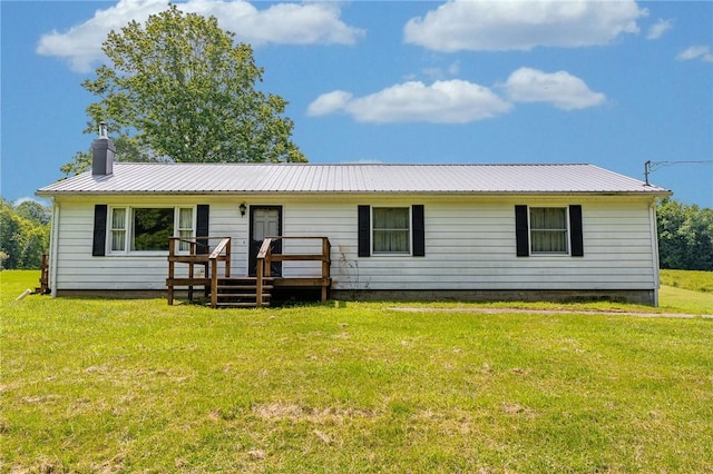 304 Wirsing Rd, Wharton Twp, PA 15440 - view of front of house featuring a metal roof, a deck, a chimney, and a front yard