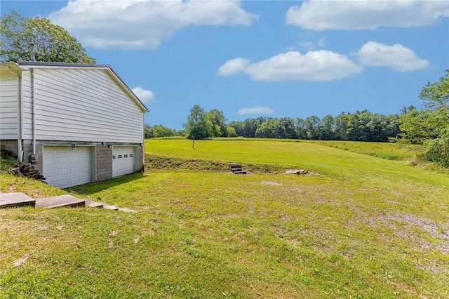 304 Wirsing Rd, Wharton Twp, PA 15440 - view of green lawn with a garage and driveway