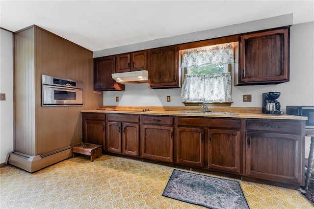 304 Wirsing Rd, Wharton Twp, PA 15440 - kitchen featuring stainless steel oven, under cabinet range hood, light countertops, and dark brown cabinets