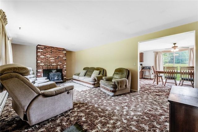 304 Wirsing Rd, Wharton Twp, PA 15440 - living area featuring carpet, a wood stove, and a ceiling fan