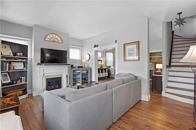 1246 Clairhaven St, Crafton Heights, PA 15205 - living room with stairway, a glass covered fireplace, and hardwood / wood-style flooring