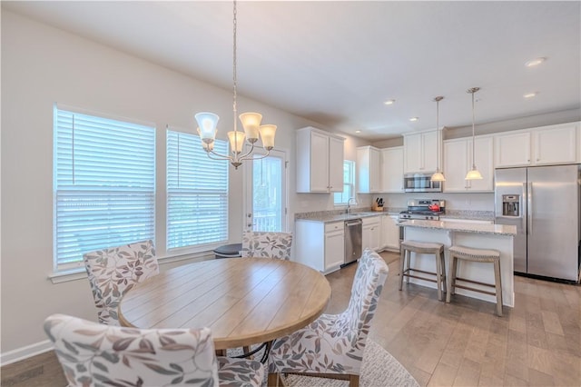 812 Theda Dori St, Cranberry Twp, PA 16066 - dining room with a chandelier, light wood-style flooring, and recessed lighting