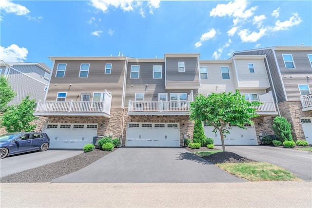 812 Theda Dori St, Cranberry Twp, PA 16066 - view of front of house with an attached garage, stone siding, and driveway