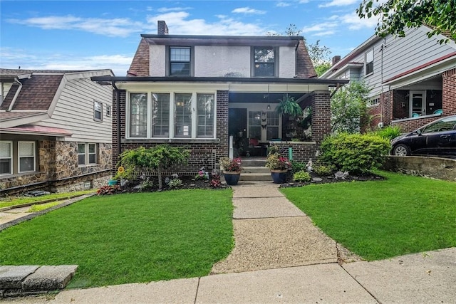432 Kenmont Ave, Mt Lebanon, PA 15228 - view of front of home featuring a front yard, a chimney, brick siding, and covered porch