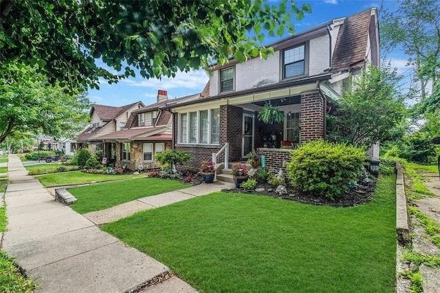432 Kenmont Ave, Mt Lebanon, PA 15228 - view of front facade with brick siding and a front lawn