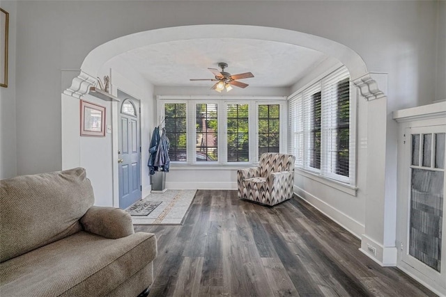 432 Kenmont Ave, Mt Lebanon, PA 15228 - living area with arched walkways, ceiling fan, and dark wood finished floors