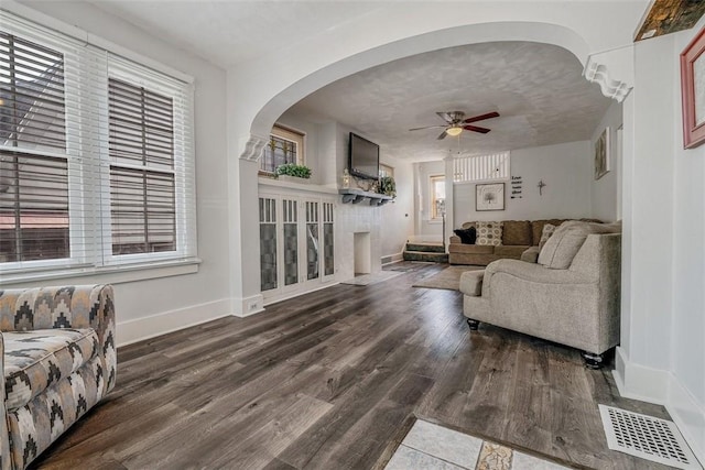 432 Kenmont Ave, Mt Lebanon, PA 15228 - living room with a ceiling fan, wood finished floors, healthy amount of natural light, and arched walkways