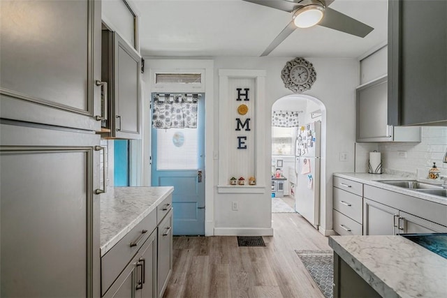 432 Kenmont Ave, Mt Lebanon, PA 15228 - kitchen featuring gray cabinetry, freestanding refrigerator, light wood-style flooring, ceiling fan, and light countertops