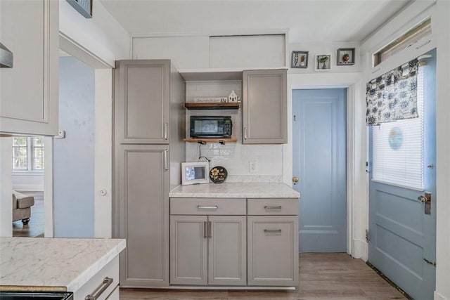 432 Kenmont Ave, Mt Lebanon, PA 15228 - kitchen featuring gray cabinets, open shelves, light countertops, and decorative backsplash