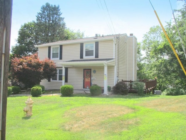 5025 Bocktown Rd, Hopewell Twp, PA 15001 - traditional-style house featuring a chimney, a front yard, and covered porch