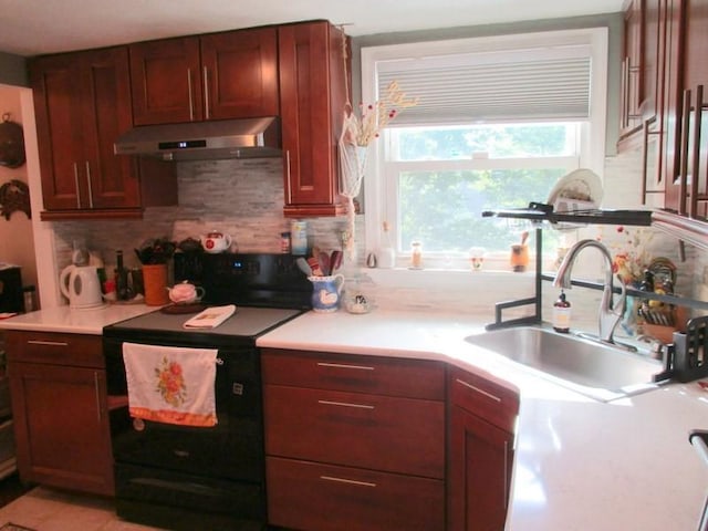 5025 Bocktown Rd, Hopewell Twp, PA 15001 - kitchen featuring black range with electric stovetop, under cabinet range hood, light countertops, and decorative backsplash