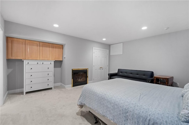 228 Highpointe Dr, Pittsburgh, PA 15220 - bedroom with light colored carpet, a glass covered fireplace, and recessed lighting
