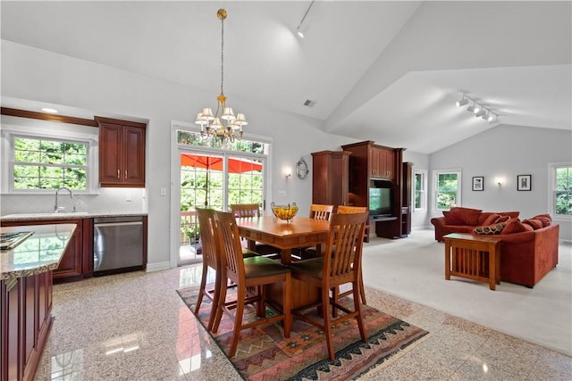 228 Highpointe Dr, Pittsburgh, PA 15220 - dining space featuring rail lighting, lofted ceiling, a chandelier, and granite tiled floors