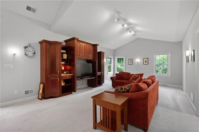228 Highpointe Dr, Pittsburgh, PA 15220 - living room with track lighting, light colored carpet, and lofted ceiling