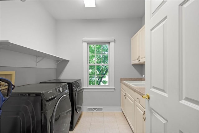 228 Highpointe Dr, Pittsburgh, PA 15220 - laundry area with separate washer and dryer, cabinet space, and light tile patterned floors