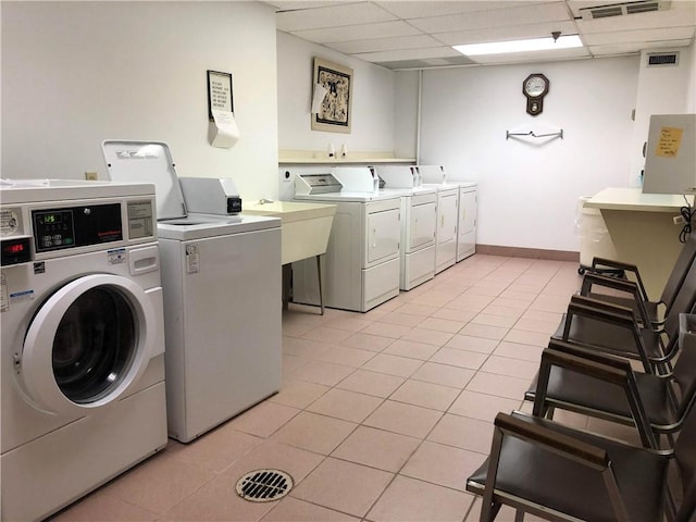 1987 Centurion Dr Unit 509, Forest Hills Boro, PA 15221 - community laundry room featuring separate washer and dryer and light tile patterned floors