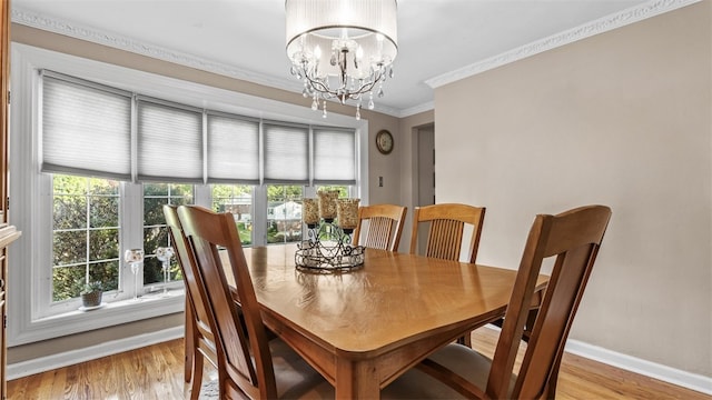 341 E Mcmurray, Peters Twp, PA 15317 - dining area featuring crown molding, a chandelier, and light wood-style flooring