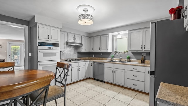 341 E Mcmurray, Peters Twp, PA 15317 - kitchen with appliances with stainless steel finishes, light tile patterned floors, and under cabinet range hood
