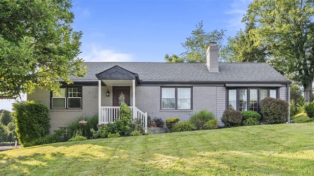 341 E Mcmurray, Peters Twp, PA 15317 - ranch-style house featuring brick siding, a front lawn, a chimney, and roof with shingles