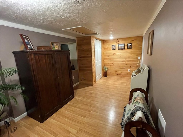 170 Laidleys Run Rd, West Finley, PA 15376 - corridor featuring light wood-style flooring, a textured ceiling, and wood walls