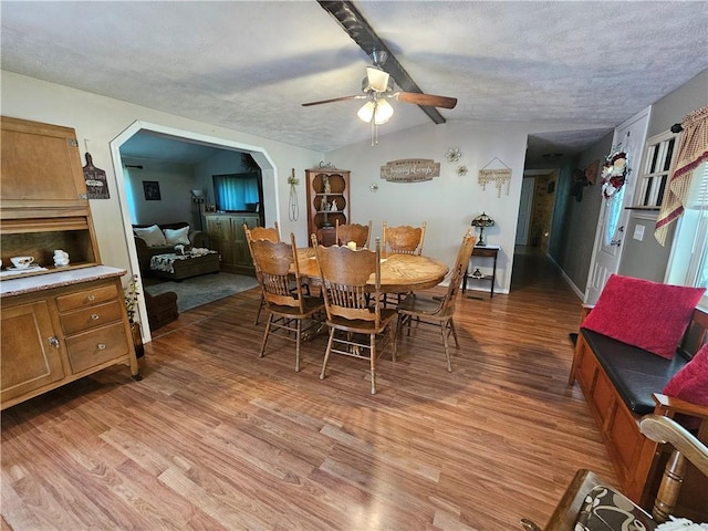 170 Laidleys Run Rd, West Finley, PA 15376 - dining area featuring light wood finished floors, ceiling fan, arched walkways, and a textured ceiling