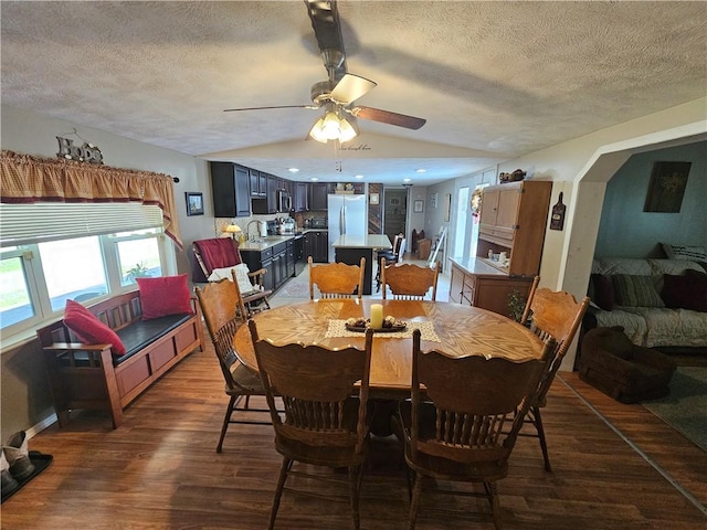 170 Laidleys Run Rd, West Finley, PA 15376 - dining area with vaulted ceiling, dark wood-style flooring, a textured ceiling, and ceiling fan