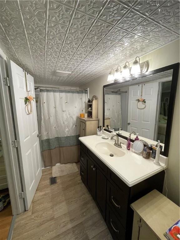 170 Laidleys Run Rd, West Finley, PA 15376 - bathroom with an ornate ceiling, wood finished floors, vanity, and a shower with curtain
