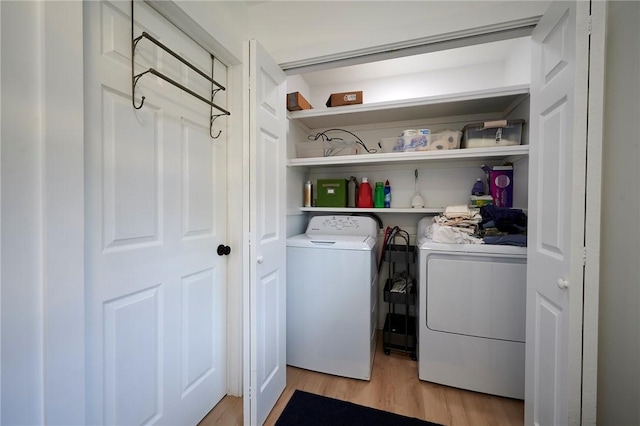 214 Youngs Ln, Sugarcreek, PA 16323 - laundry room with light wood-style flooring and washer and clothes dryer