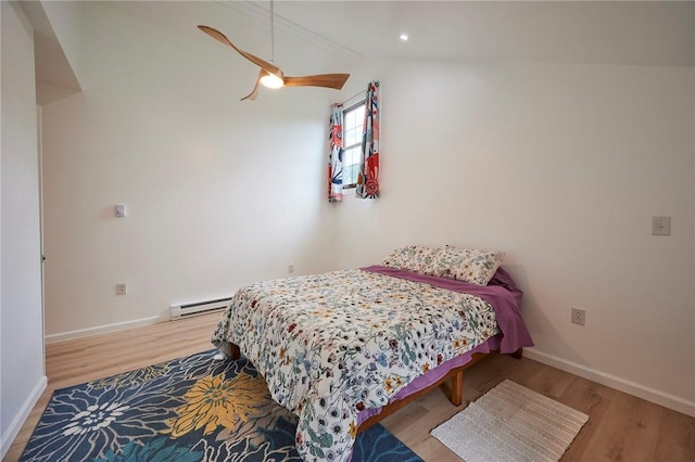 214 Youngs Ln, Sugarcreek, PA 16323 - bedroom featuring wood finished floors, lofted ceiling, a baseboard radiator, a ceiling fan, and recessed lighting