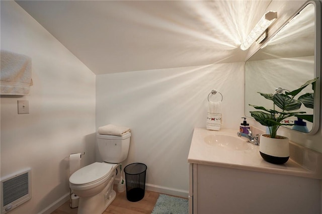 214 Youngs Ln, Sugarcreek, PA 16323 - half bathroom with heating unit, vanity, vaulted ceiling, and wood finished floors