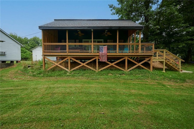 214 Youngs Ln, Sugarcreek, PA 16323 - rear view of house with a ceiling fan, a lawn, a deck, and board and batten siding