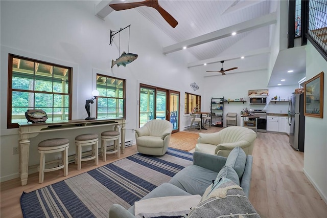 214 Youngs Ln, Sugarcreek, PA 16323 - living area featuring ceiling fan, high vaulted ceiling, beam ceiling, plenty of natural light, and light wood finished floors
