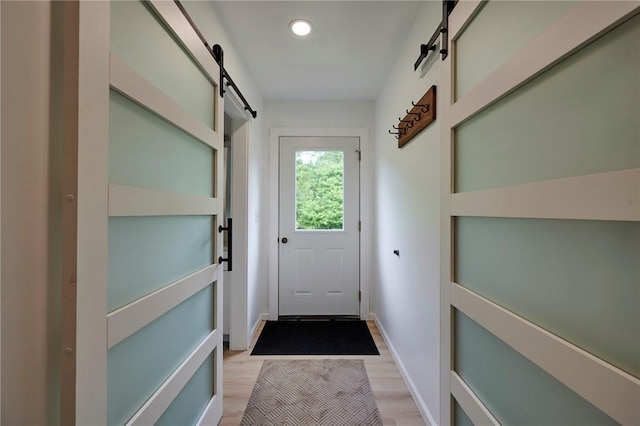214 Youngs Ln, Sugarcreek, PA 16323 - doorway to outside with a barn door, light wood-style flooring, and recessed lighting