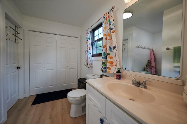 214 Youngs Ln, Sugarcreek, PA 16323 - bathroom with vanity, wood finished floors, and a closet