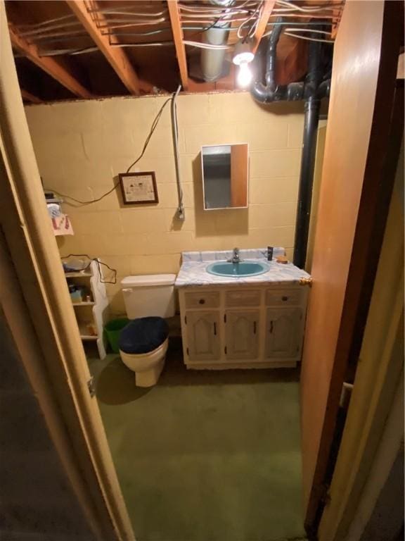 39 Hogue Rd, West Middlesex Boro, PA 16159 - bathroom featuring vanity, concrete floors, and concrete block wall